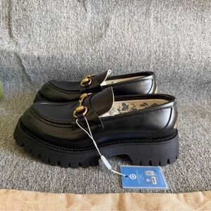 Gucci Black Leather Loafers with Gold Accent